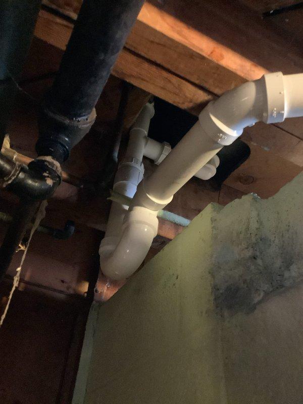 Replaced old drum trap and associated pipe work for the bathtub drainage system. Installed new PVC P-trap configuration with multiple joints and connectors to ensure proper drainage. All materials were ordered for will-call pickup as specified in the approved quote.