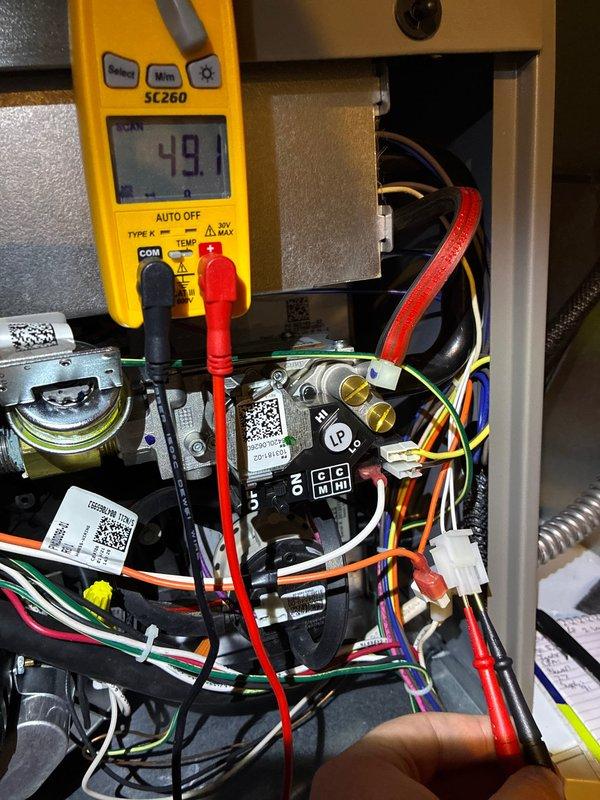 Performed scheduled furnace maintenance for MVP member on 5-year-old unit. Conducted comprehensive tune-up including electrical testing with Fieldpiece SC260 multimeter, verifying voltage readings of approximately 49.1V across components. Utilized hex key tool during service to access and adjust internal mechanisms as part of standard preventive maintenance protocol.