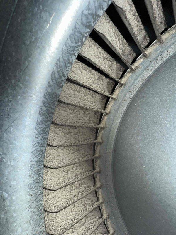 Responded to customer call reporting furnace unable to maintain temperature above 62°F despite thermostat replacement. Inspection revealed significant dust accumulation on blower wheel impeding proper airflow. Cleaned blower assembly and verified proper operation of temperature probe/sensor connections. System now functioning normally and maintaining set temperature.