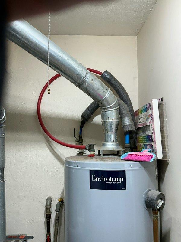 Performed an on-site estimate for furnace replacement in utility room containing existing HVAC system, washing machine, and Envirotemp water heater. Evaluated current ductwork configuration and ventilation requirements. Documented existing setup with photos to develop appropriate replacement proposal.