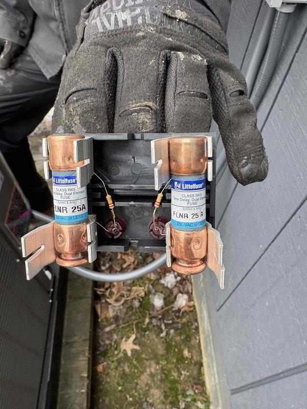 Completed installation of Lennox AC unit on concrete platform with proper electrical connection (FLNR 25A fuses installed in disconnect switch). Added air cleaner system to ensure adequate filtration for the system. All components properly mounted and connected to home's exterior.