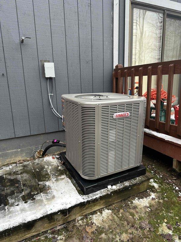 Completed installation of Lennox AC unit on concrete platform with proper electrical connection (FLNR 25A fuses installed in disconnect switch). Added air cleaner system to ensure adequate filtration for the system. All components properly mounted and connected to home's exterior.