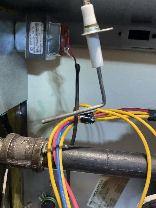 Performed annual maintenance service on 9-year-old natural gas MVP furnace. Inspected flame sensor, ignition system, and electrical connections, confirming proper operation. Examined basement installation area including ventilation and exhaust components, with all systems functioning within normal parameters.