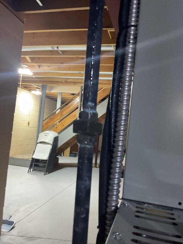Performed annual maintenance service on 9-year-old natural gas MVP furnace. Inspected flame sensor, ignition system, and electrical connections, confirming proper operation. Examined basement installation area including ventilation and exhaust components, with all systems functioning within normal parameters.