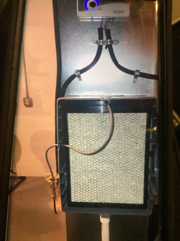 Performed standard tune-up on 4-year-old furnace that had been rolled three times during summer. Inspected ductwork to assess cleaning needs. Examined humidifier system (Aprilaire) and verified proper operation with all components intact. Inspected fan assembly which showed normal dust accumulation but remains in functional condition.