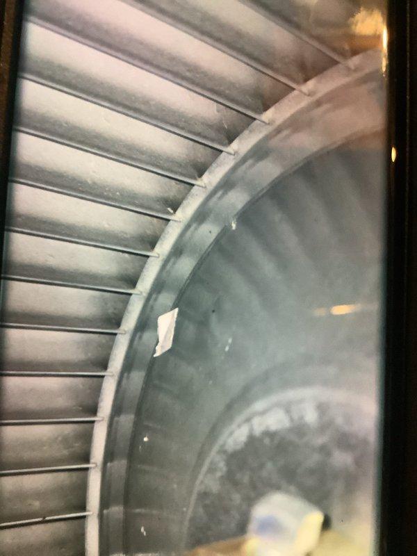 Performed standard tune-up on 4-year-old furnace that had been rolled three times during summer. Inspected ductwork to assess cleaning needs. Examined humidifier system (Aprilaire) and verified proper operation with all components intact. Inspected fan assembly which showed normal dust accumulation but remains in functional condition.