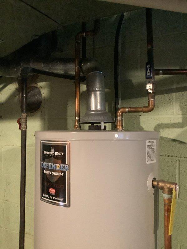 Responded to service call for Bradford White tanked water heater. Performed scheduled maintenance inspection on residential unit with Defender Safety System. Verified proper operation of all connections including copper supply lines and exhaust venting. System functioning normally after service.