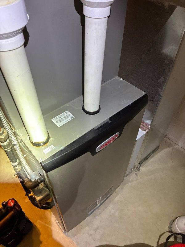 Performed scheduled maintenance on 6-year-old Lennox MVP gas furnace. Conducted thorough inspection of system components, including exhaust/intake piping and electrical connections. Used hex key tool to access and service internal components while verifying proper operation of the heating system.