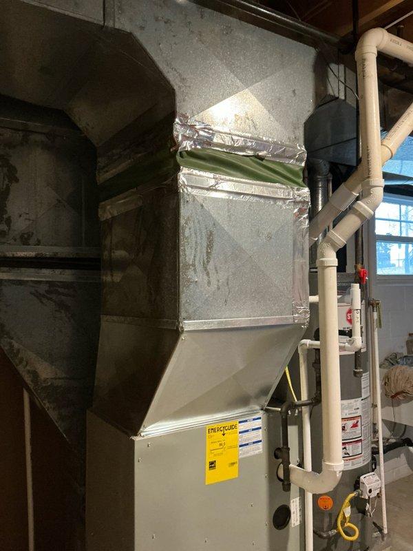 Conducted furnace replacement evaluation for Frank BB at residential property. Current unit significantly undersized for the space. Documented existing installation including air handler connections, ductwork configuration, and PVC condensate drainage system to determine appropriate replacement specifications.
