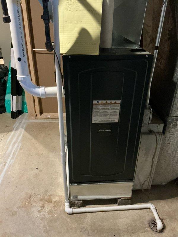 Conducted furnace replacement evaluation for Frank BB at residential property. Current unit significantly undersized for the space. Documented existing installation including air handler connections, ductwork configuration, and PVC condensate drainage system to determine appropriate replacement specifications.