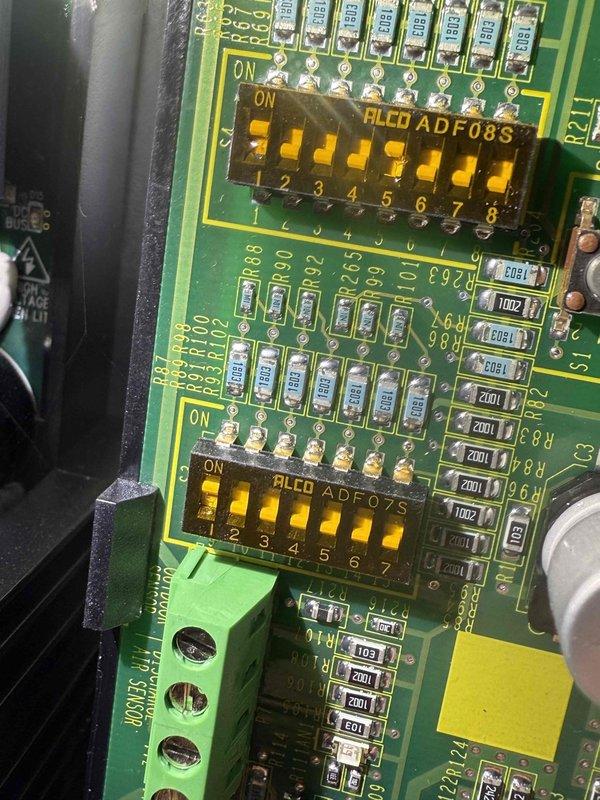 Performed scheduled maintenance on 2-year-old heating system. Conducted PCB inspection of control board with focus on DIP switch settings. Verified electrical readings using multimeter, confirming proper amperage (0.1A) and voltage (0.00V) at key connection points.