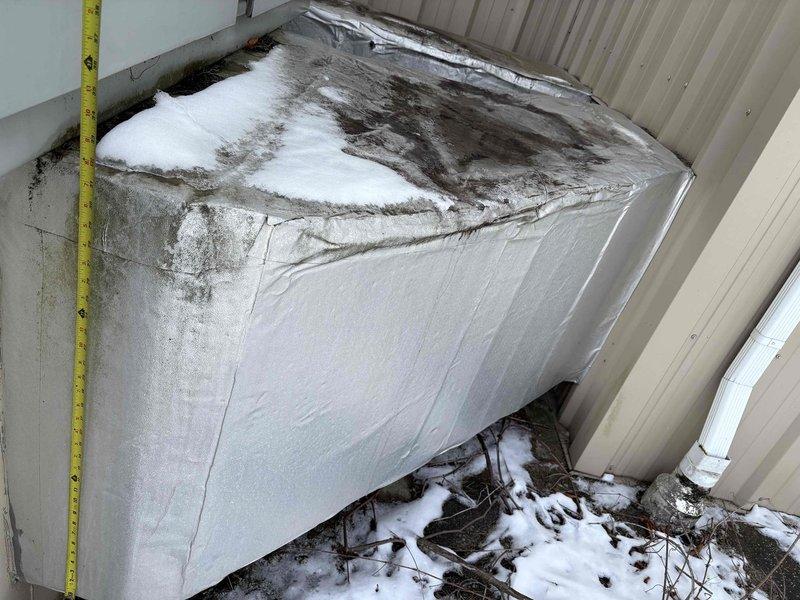 Conducted site assessment for commercial rooftop unit replacement. Documented existing equipment condition showing significant deterioration and staining on upper surface. Took measurements of unit for proper sizing specifications. Equipment was not accessed from roof during this initial evaluation visit.