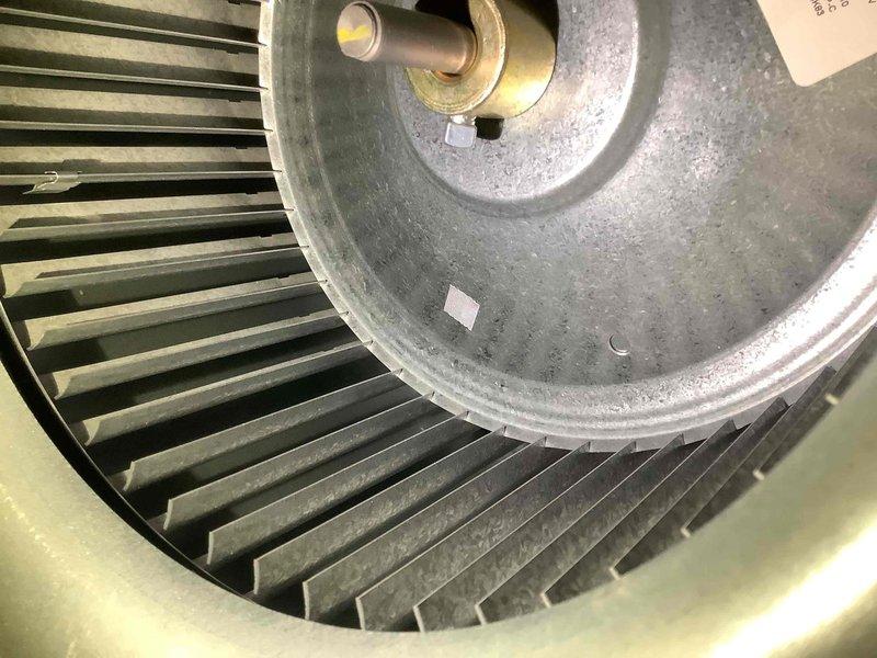 Performed scheduled heating maintenance on 5-year-old system. Inspected and cleaned blower wheel assembly which showed normal dust accumulation but no significant damage. Checked system components using specialized testing tool to verify proper operation.