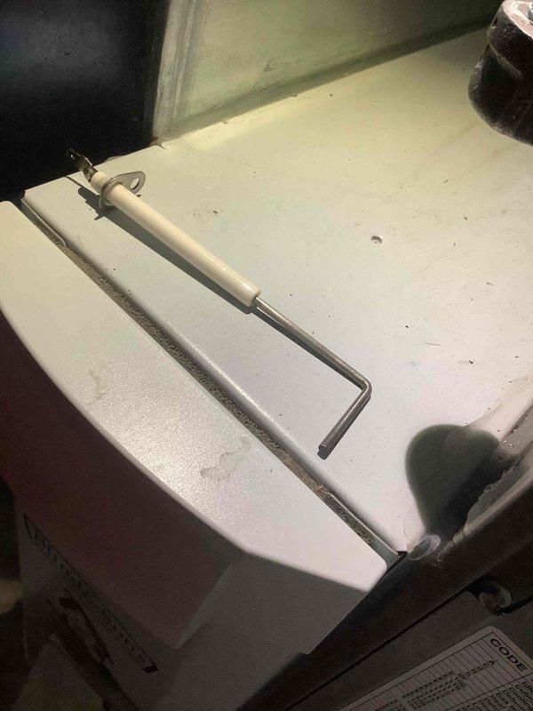 Performed scheduled heating maintenance on 5-year-old system. Inspected and cleaned blower wheel assembly which showed normal dust accumulation but no significant damage. Checked system components using specialized testing tool to verify proper operation.