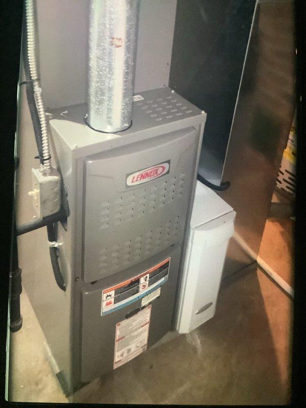 Performed maintenance on 7-year-old Lennox furnace system. Identified significant frost accumulation on evaporator coils and corrosion in drain pan, indicating potential refrigerant or airflow issues. Inspected outdoor unit connection to house as requested by customer and resealed penetration points to prevent pest intrusion.