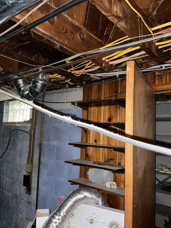 Performed comprehensive assessment of 25-year-old Bryant 89 furnace and AC system in basement utility area. Evaluated existing ductwork configuration, noting potential sizing inadequacies due to home addition. System shows normal wear consistent with age. Documented current installation including furnace unit, connected ductwork network, and PVC venting to determine appropriate replacement options and possible ductwork modifications.