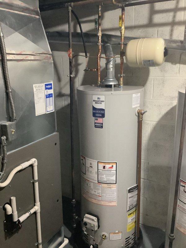 Successfully replaced two 50-gallon water heaters with new Bradford White units, each with expansion tanks, new shut-off valves, and drain pans routed to the floor drain. Upgraded the plumbing system by replacing two 1/2" stop and waste valves in the utility room ceiling with quarter-turn ball valves, and installed new quarter-turn ball valves in the copper lines serving the first floor kitchen and basement bar sinks. All installations include manufacturer's 10-year warranty on tanks.