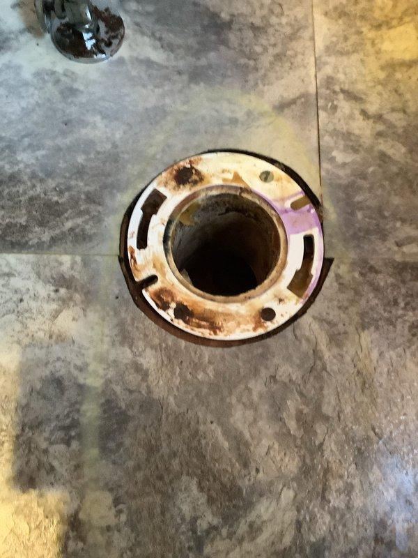 Replaced severely corroded toilet flange and installed new toilet as per work order. Removed old rusted fixture, prepared mounting surface, and successfully completed installation of customer-supplied white porcelain toilet with all necessary connections.