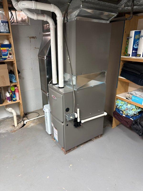 Completed installation of a new high-efficiency furnace with proper PVC venting. Conducted post-installation diagnostic testing using UEi EM201B meter, confirming system pressure reading of 3.37, which is within manufacturer specifications. System was properly positioned in utility area with all connections secured and operational verification completed.