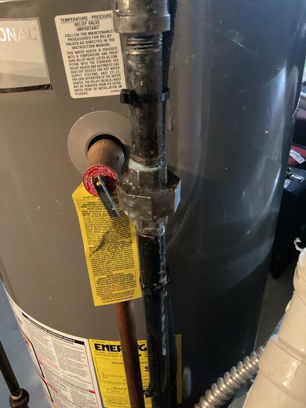 Performed annual maintenance on 1-year-old gas furnace. Inspected water heater and relief valve system, noting normal operation with no visible leaks or corrosion issues at connection points. Used hex key to access and check furnace components, confirming proper operation of heating system with all electrical connections secure.