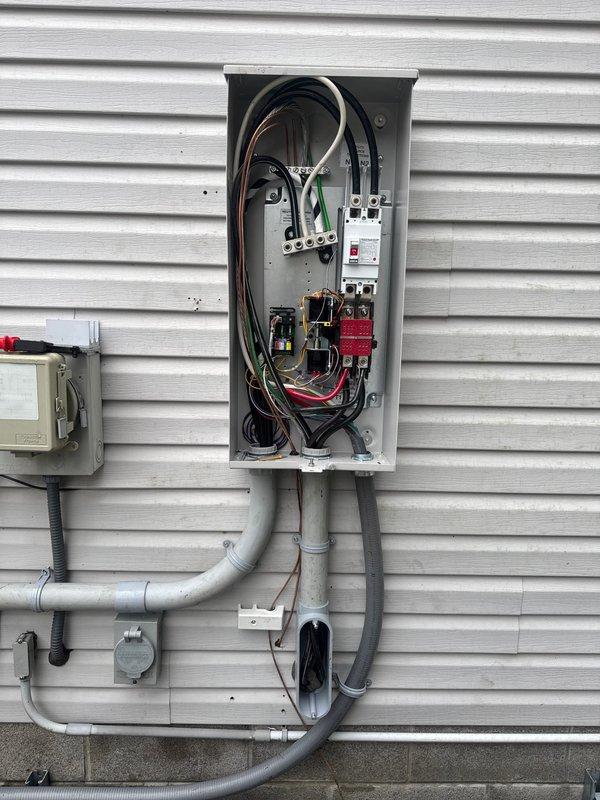 Successfully installed 18kW generator with 200amp transfer switch and cold weather kit. Completed electrical connections in main panel with proper wiring and conduit installation. Extended gas line 15 feet using mega press fittings and verified all connections meet local code requirements.