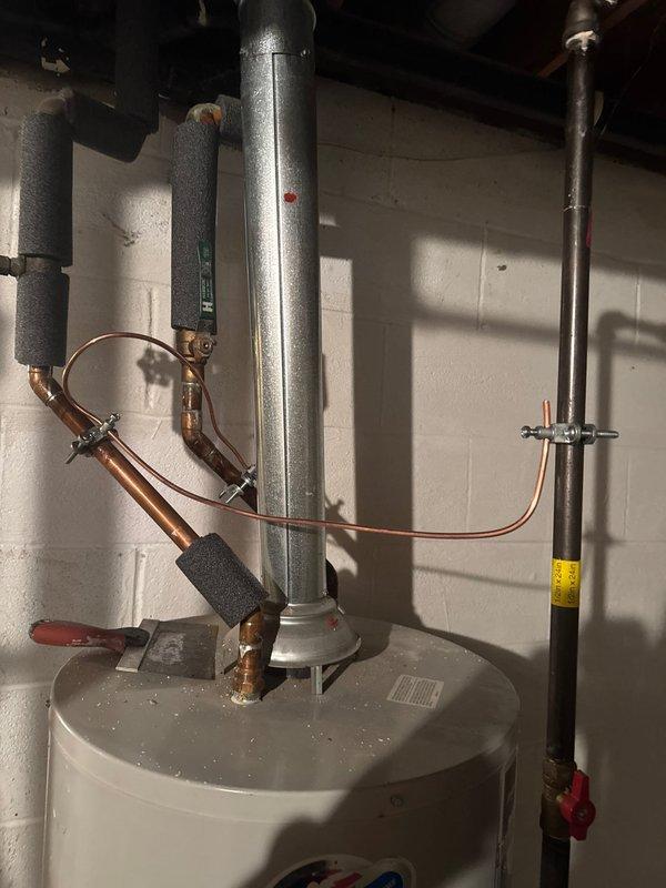 Successfully installed 18kW generator with 200amp transfer switch and cold weather kit. Completed electrical connections in main panel with proper wiring and conduit installation. Extended gas line 15 feet using mega press fittings and verified all connections meet local code requirements.