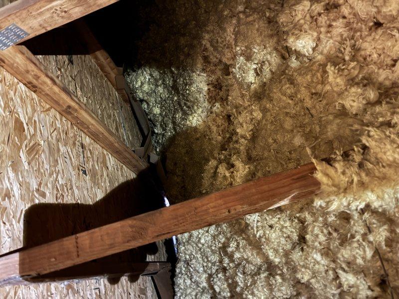 Responded to service call for non-operational bathroom exhaust fan. Upon inspection, accessed attic space to examine fan unit and ductwork. Located ventilation grille in bathroom with proper airflow path. Diagnosed electrical issue with fan motor, replaced component and verified proper operation before completing service.