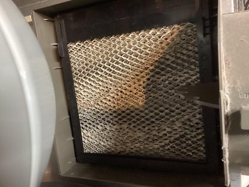 Performed routine maintenance on 4-year-old heat pump system. Inspected and verified condition of evaporative pad/humidifier element showing normal wear. Examined and confirmed proper installation of air filter in the air handler unit. All components functioning correctly with no issues identified.