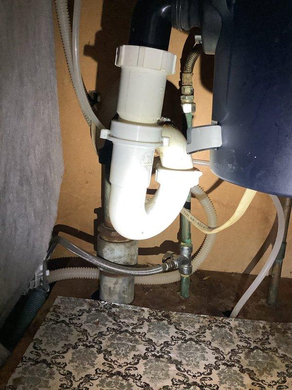 Responded to service call to install new dishwasher and remove old unit. Inspected and connected plumbing components including water supply lines and drainage system. Properly installed P-trap assembly with PVC piping and verified all connections were secure with no leaks present.