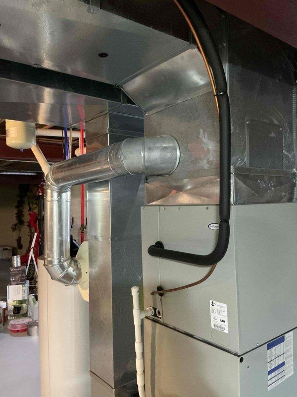 Conducted furnace inspection and identified critical heat exchanger crack in existing Trane unit. Recommended complete system replacement due to safety concerns and potential carbon monoxide risks. Documented current installation configuration for proper replacement specifications.