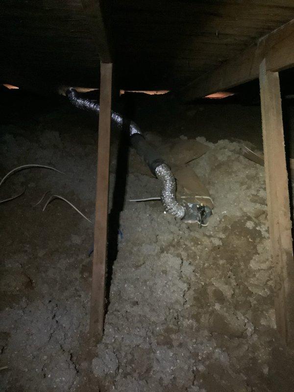 Replaced faulty bathroom exhaust fan switch with new stacked switch configuration. Accessed ventilation system through ceiling panel and crawl space to complete proper installation of exhaust components. All electrical connections were properly terminated and system functionality was verified.