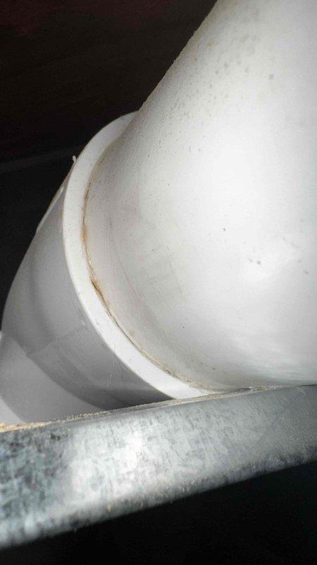 Replaced leaking three-quarter inch PVC condensate drain line and installed two 45-degree elbows on exhaust piping that were previously causing water leakage. Verified proper drainage function and secure connections after installation to ensure system operates correctly without water discharge onto floor.