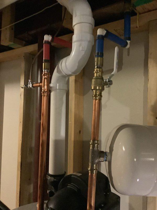 Successfully completed routine maintenance on a 14-year-old tanked water heater system, performing a comprehensive flush to remove sediment buildup and ensure optimal performance. Inspected all components including copper supply lines, pressure relief valve, and expansion tank, confirming proper operation with no leaks or signs of deterioration.