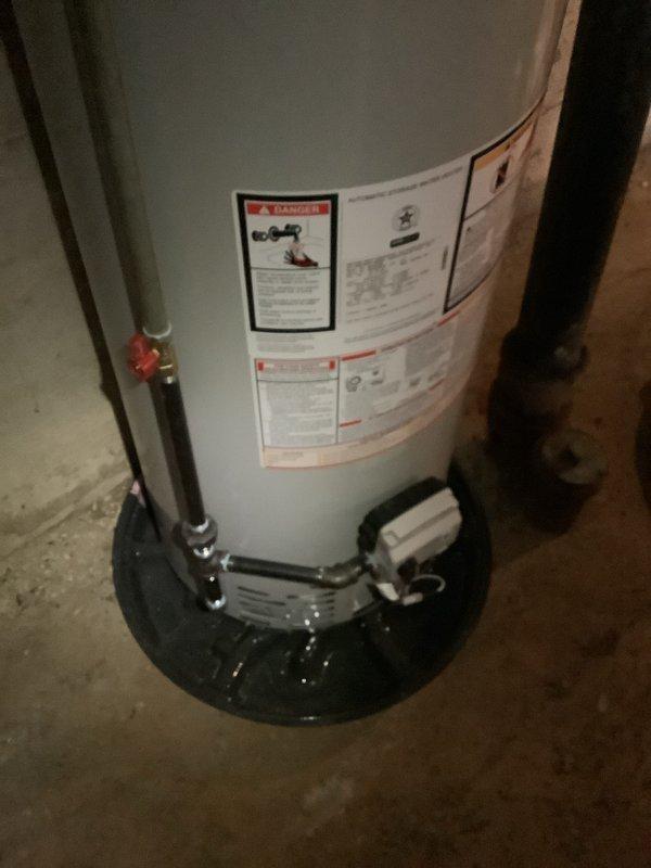 Completed installation of an 80-gallon high-efficiency water heater in basement utility area. Unit was properly connected to existing plumbing with new copper piping and shut-off valve. Installed drain pan beneath unit to prevent potential water damage and ensured all safety features were operational.
