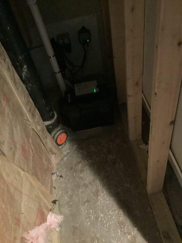 Completed replacement of maintenance-free batteries for two backup sump pumps in the home's utility area. Installed new batteries to ensure continued protection against water damage during power outages. System tested and verified operational with proper indicator lights functioning.