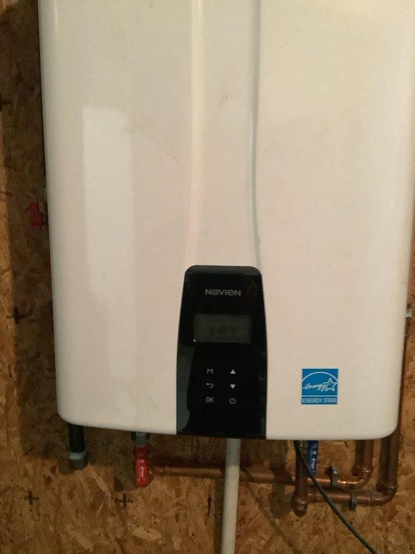 Performed preventative maintenance service on Navien NPE-240A2 (NG) tankless water heater. Completed full descaling procedure to remove mineral buildup and ensure optimal heat transfer efficiency. System was tested after service and is operating within manufacturer specifications.