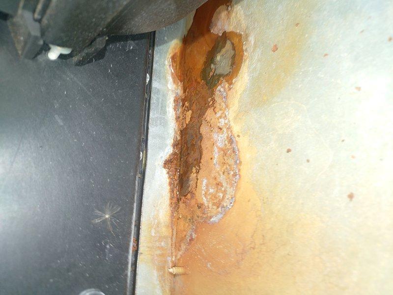 Diagnosed 15+ year old gas furnace with no heat issue. Found multiple ignition failure error codes and significant corrosion damage to heat exchanger components. Observed severe rust deterioration with visible holes forming in the metal surface near copper line connection, indicating end-of-life system failure. Recommended replacement due to safety concerns and uneconomical repair costs for aging unit.