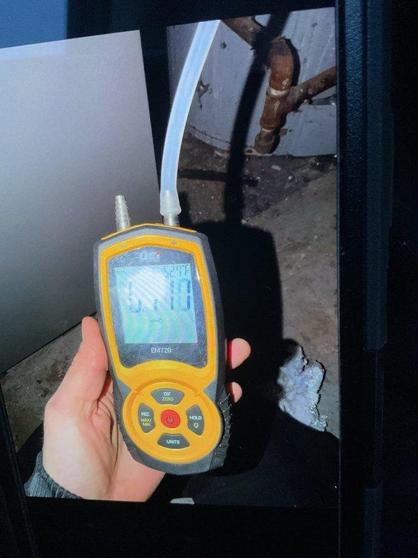 Connected furnace and water heater flues per customer request and performed startup procedures. Used UEi EMT20 test instrument to take diagnostic readings on the system. Inspected ductwork installation including the 90-degree elbow joint, noting some moisture signs on adjacent wall that customer should monitor.