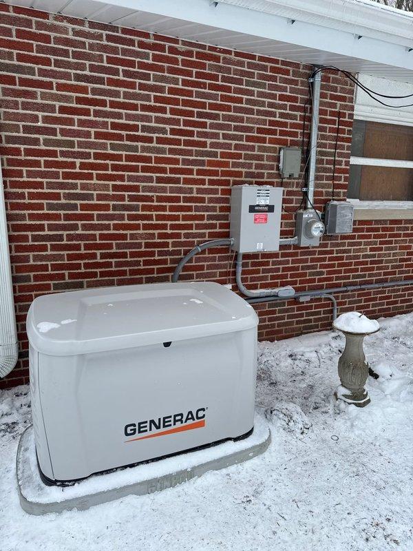 Completed installation of a Generac 22kW whole-home generator system with 100 amp service upgrade. Installation included running a 60-foot gas line and proper mounting of the generator unit on a concrete pad. System was successfully connected to the home's electrical panel with all necessary transfer equipment installed on the exterior wall.
