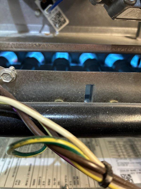 Performed routine maintenance on 5-year-old MVP BS-MVP heating system. Inspected gas burner flames which showed proper blue color indicating good combustion. Checked and cleaned condensate drain tube to prevent potential blockages and ensure proper system drainage.