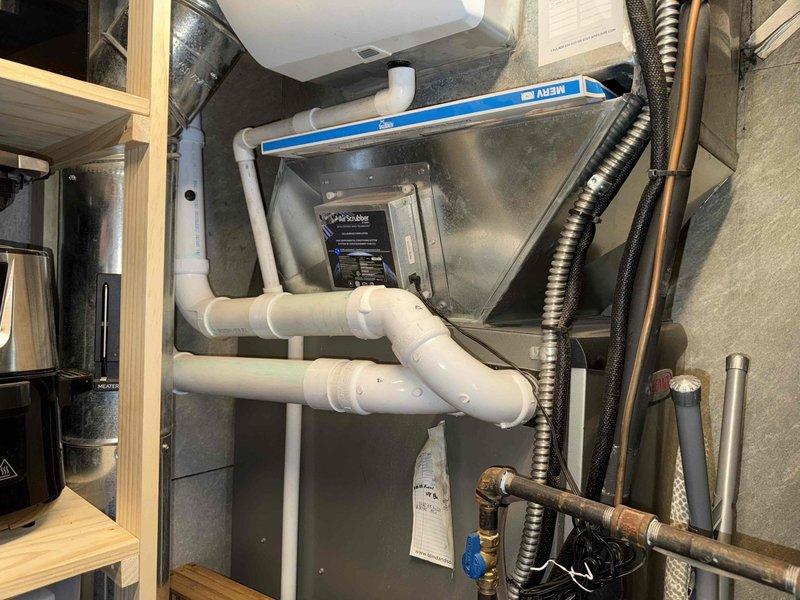 Responded to no heat call for 4-year-old Lennox furnace. Diagnosed condensate drain system issues with improper slope. Installed new PVC condensate drain lines with correct pitch using bubble level to ensure proper drainage. System now functioning normally with heat restored.