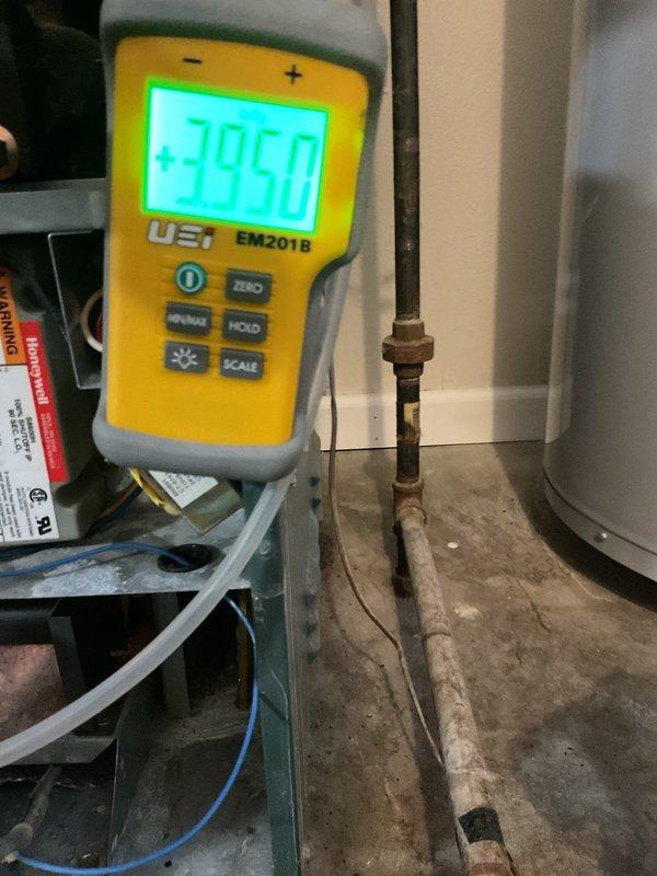Responded to service call for a 20+ year old gas boiler with no heat and gas odor throughout the residence. Performed combustible gas leak test with UEI EM201B meter, detecting significant gas leak reading of 39.50 at the boiler's gas valve assembly and manifold connections. Inspection revealed severely corroded gas piping and deteriorated control board wiring. Recommended immediate system replacement due to safety hazards and advanced age of equipment.