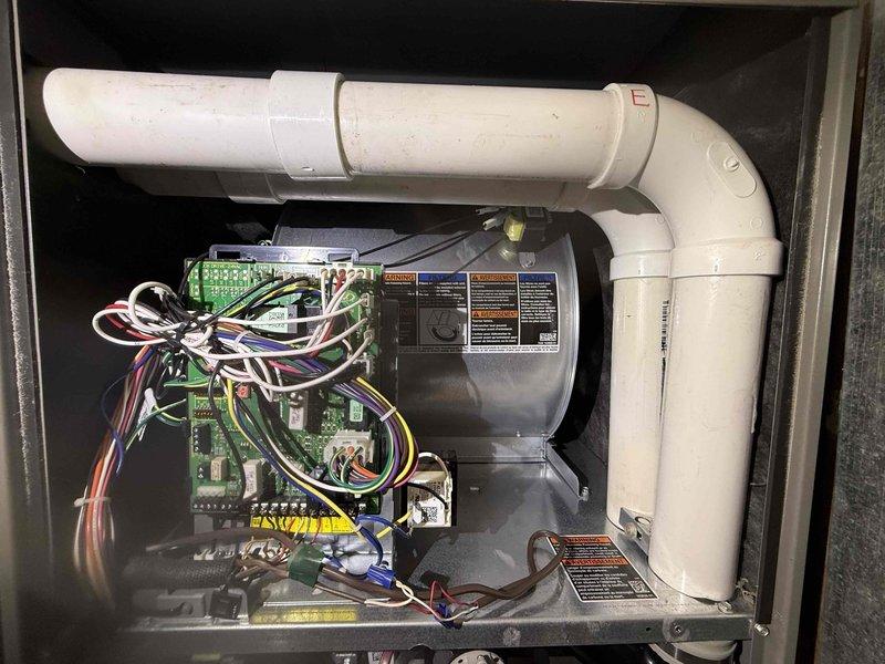 Performed scheduled MVP heating maintenance visit on 1-year-old system that was rescheduled from previous appointment. Inspected control board and DIP switch settings, checked wiring connections at terminal blocks, and examined blower motor assembly and ventilation components. All systems operating within normal parameters.