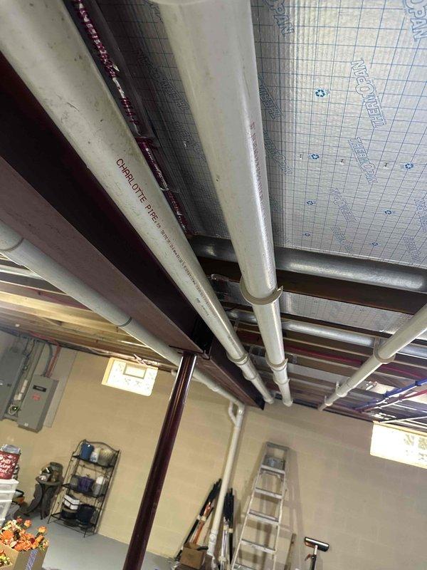 Successfully installed new Lennox 90% efficiency furnace with proper venting through white PVC exhaust pipes. Completed all connections to existing ductwork and verified system operation before finalizing installation.