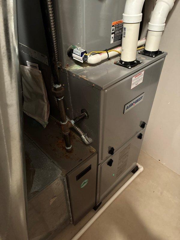 Completed routine heating system maintenance on 11-year-old Airtemp furnace. Performed comprehensive tune-up including inspection of exhaust venting, copper line connections, and control components. Identified minor rust formation at copper piping connection point, but system remains in good operational condition through 2024 maintenance validation period.