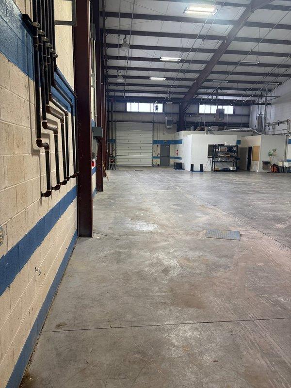 Installed electrical power supply to customer's newly installed garage door in industrial warehouse space. Connected power from existing nearby electrical source to the garage door operator, ensuring proper function and code compliance.