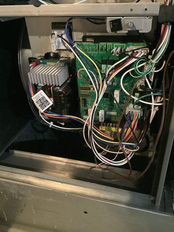 Performed scheduled furnace tune-up service on residential HVAC system. Inspected control board circuitry and electrical connections, confirming proper functionality. Examined furnace unit with PVC venting system and verified all components were operating within normal parameters.