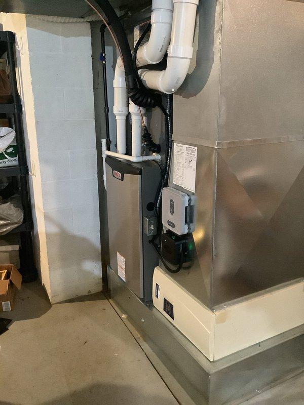 Performed scheduled furnace tune-up service on residential HVAC system. Inspected control board circuitry and electrical connections, confirming proper functionality. Examined furnace unit with PVC venting system and verified all components were operating within normal parameters.
