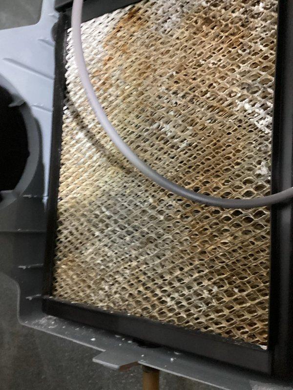 Performed annual maintenance check on 12-year-old Amana furnace system (MVP: 2024). Inspected Lennox furnace unit including PVC ventilation pipes, ductwork, and attached humidifier system. Examined air filter which showed significant dust accumulation and discoloration requiring replacement. System confirmed operational with no issues detected.