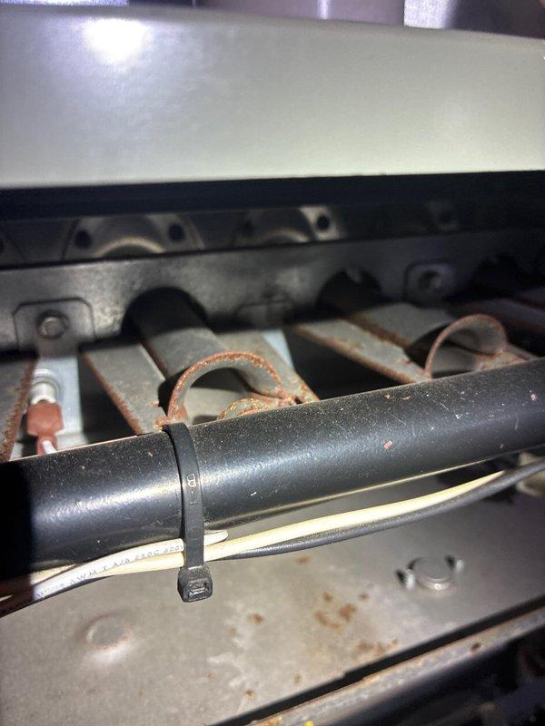 Performed routine maintenance on 15-year-old MVP furnace. Inspected burner assembly and heat exchanger, noting significant oxidation and corrosion on burner tubes. Adjusted components using hex tool to ensure proper operation despite age-related wear.